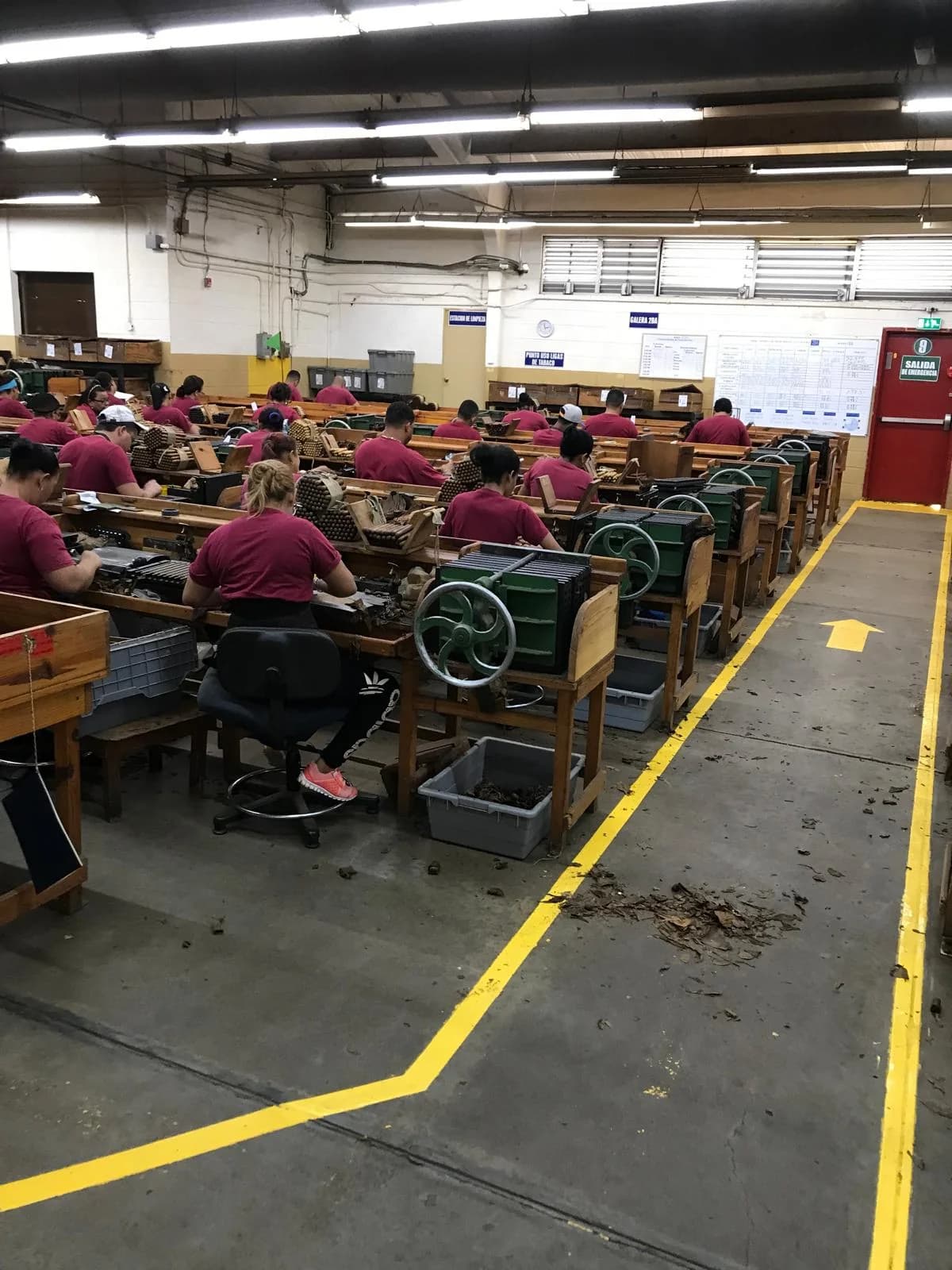 People at manual production workstations